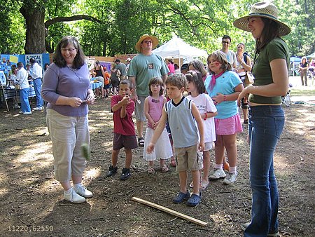 kids playing a beanbag game.